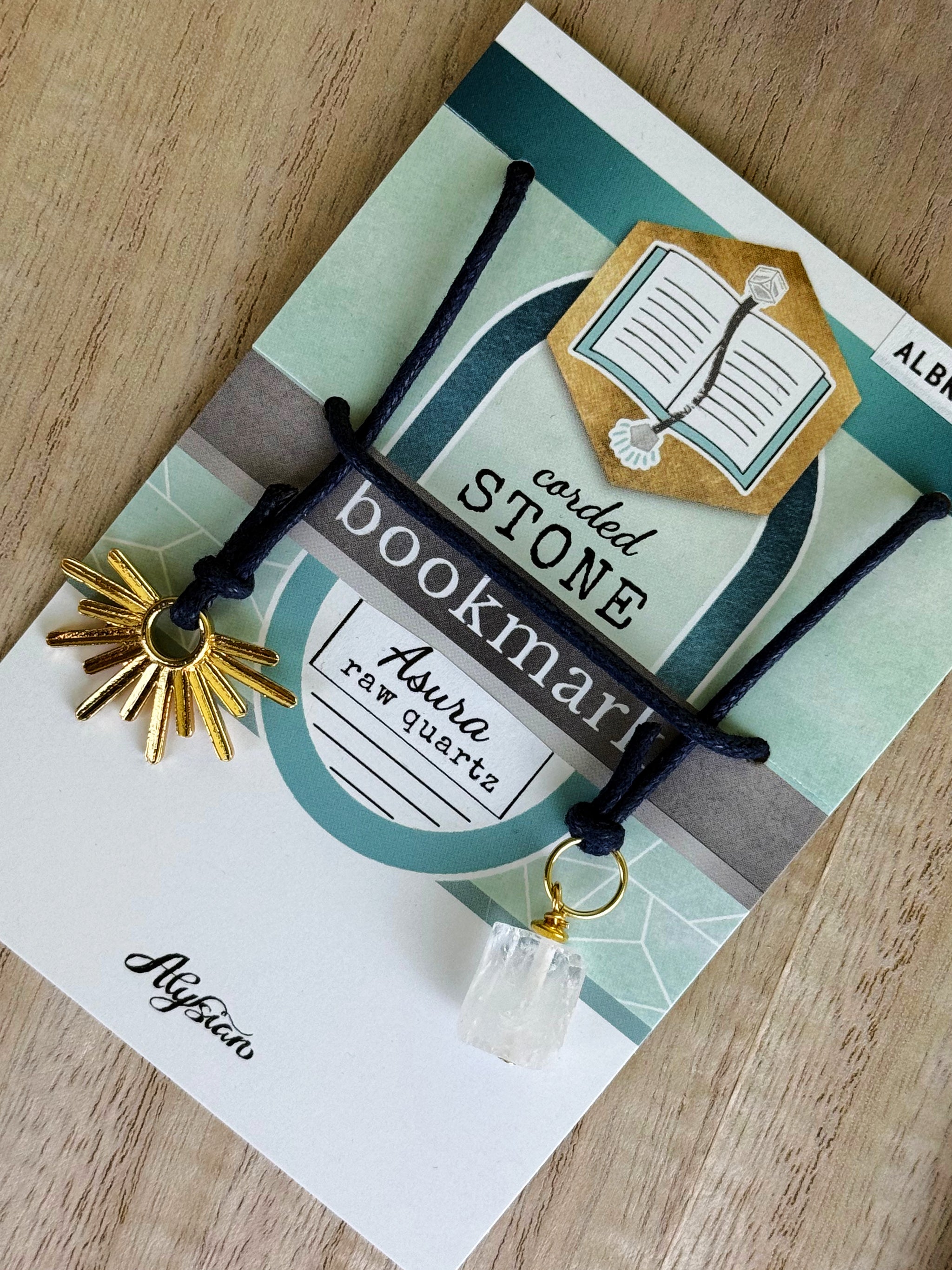 Asura Raw Quartz Bookmark – A handcrafted bookmark by Alysian - on card packaging.