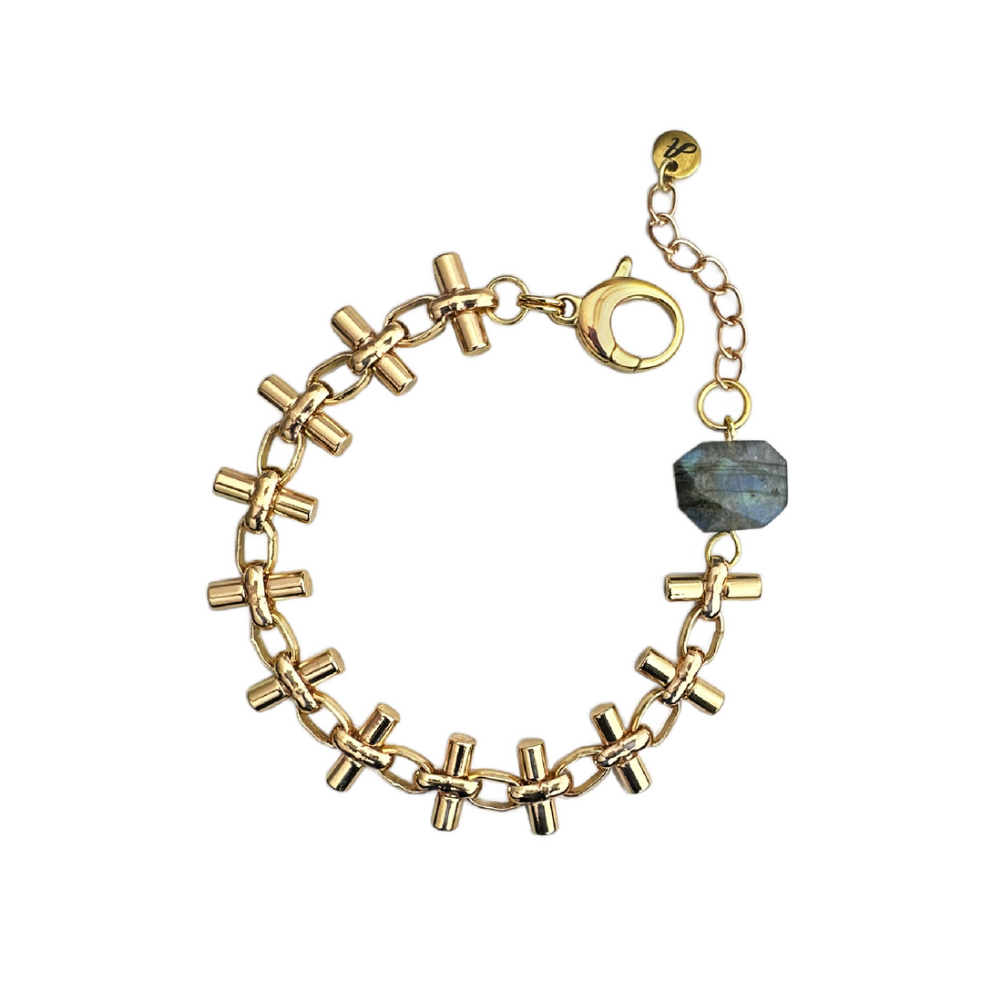 A gold-plated brass statement bracelet with a unique bar chain design and a faceted gray labradorite gemstone. Handcrafted by Alysian. 