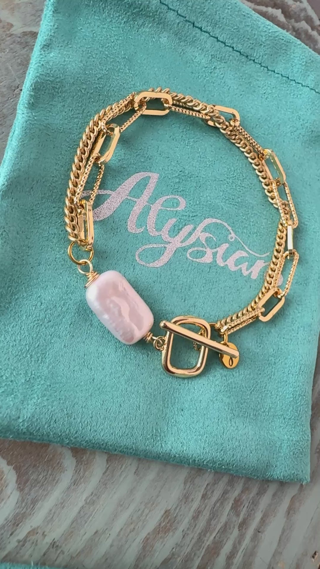 Arlowe double chain strand bracelet with a toggle and focal freshwater pearl, handcrafted by Alysian.